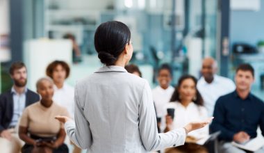 Rearview shot of an unrecognizable businesswoman giving a presentation in the office boardroom