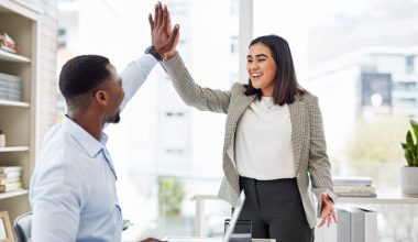 A man and woman high-five