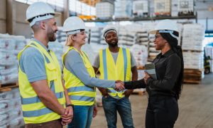 Work team in factory warehouse