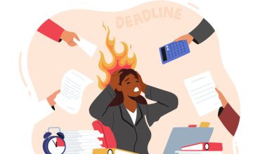 Illustration of a Black woman sitting at a cluttered desk with flames coming from her head, surrounded by hands holding work items, symbolizing stress and looming deadlines.