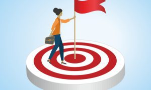 Business professional standing on a red-and-white target holding a flag, symbolizing achieving leadership goals and success.