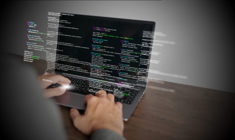 Hands of a software developer typing on a laptop displaying Python code, symbolizing coding technology, software development, web applications, IT solutions, and digital innovation.