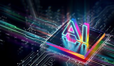 A colorful, glowing “AI” chip sits on top of a digital circuit board, representing advanced artificial intelligence technology.