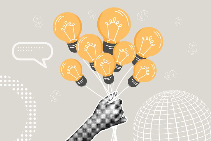 Illustration of a hand holding a bunch of light bulbs like balloons against a gray background. The light bulbs are bright orange with black bases, symbolizing ideas or creativity. Surrounding elements include a speech bubble, dollar signs, dotted patterns, and a wireframe globe, giving the image a modern, conceptual design.