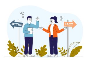 Illustration of two people standing between directional signs labeled “MYTHS” (left) and “FACT” (right). One person wears a blue shirt and dark pants, holding a book and raising a hand; the other wears an orange jacket over a white top with dark pants, gesturing with open hands. Question marks appear above their heads, with green plants at the bottom.