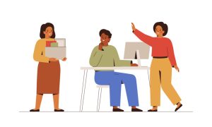 Illustration of three people in an office setting: a woman in a yellow top and brown skirt holding a box of folders, a man in a green shirt and blue pants sitting at a desk with a computer, and a woman in a red top and yellow pants standing beside him with one arm raised as if explaining something.