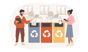 Illustration of a man in a red sweater and brown pants holding a tablet and placing papers into a blue recycling bin, alongside a woman in a pink top and blue skirt holding a phone and throwing a tissue into a yellow bin. Three bins—blue, red, and yellow—each display a white recycling symbol, set in an office with desks and laptops in the background.