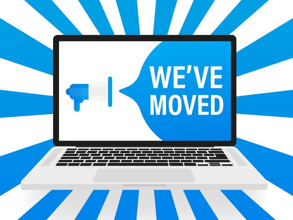 Illustration of a laptop displaying a blue megaphone and the text “WE’VE MOVED,” with blue and white radial rays emanating in the background.